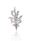 Silver leaf-shaped brooch with blue gemstones on a white background