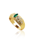 Gold ring with emerald and diamonds on a white background