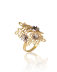 Gold ring with floral designs on a white background