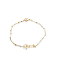 Gold bracelet with a unique clasp design on a white background
