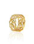 Gold ring with intricate design on a white background