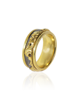 Gold ring with intricate design on a white background
