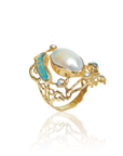 Gold ring with a large pearl and smaller gemstones on a white background