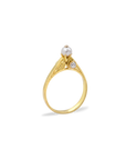 Gold ring with pearls on a white background
