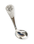 Silver spoon with decorative head on a white background