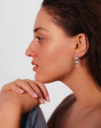 Marilisi artisan fine jewelry White gold diamonds green emerald symmetrical art deco Latch Back earrings front side Latch Back On the Model