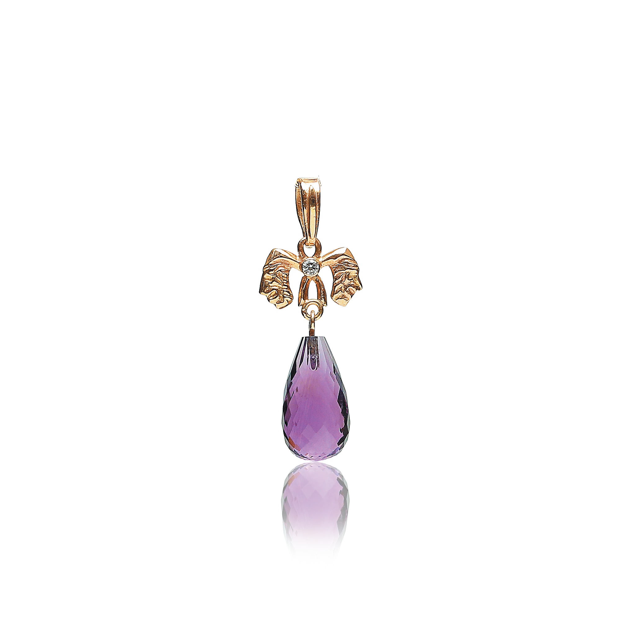 Gold pendant with a purple teardrop-shaped gemstone on a white background