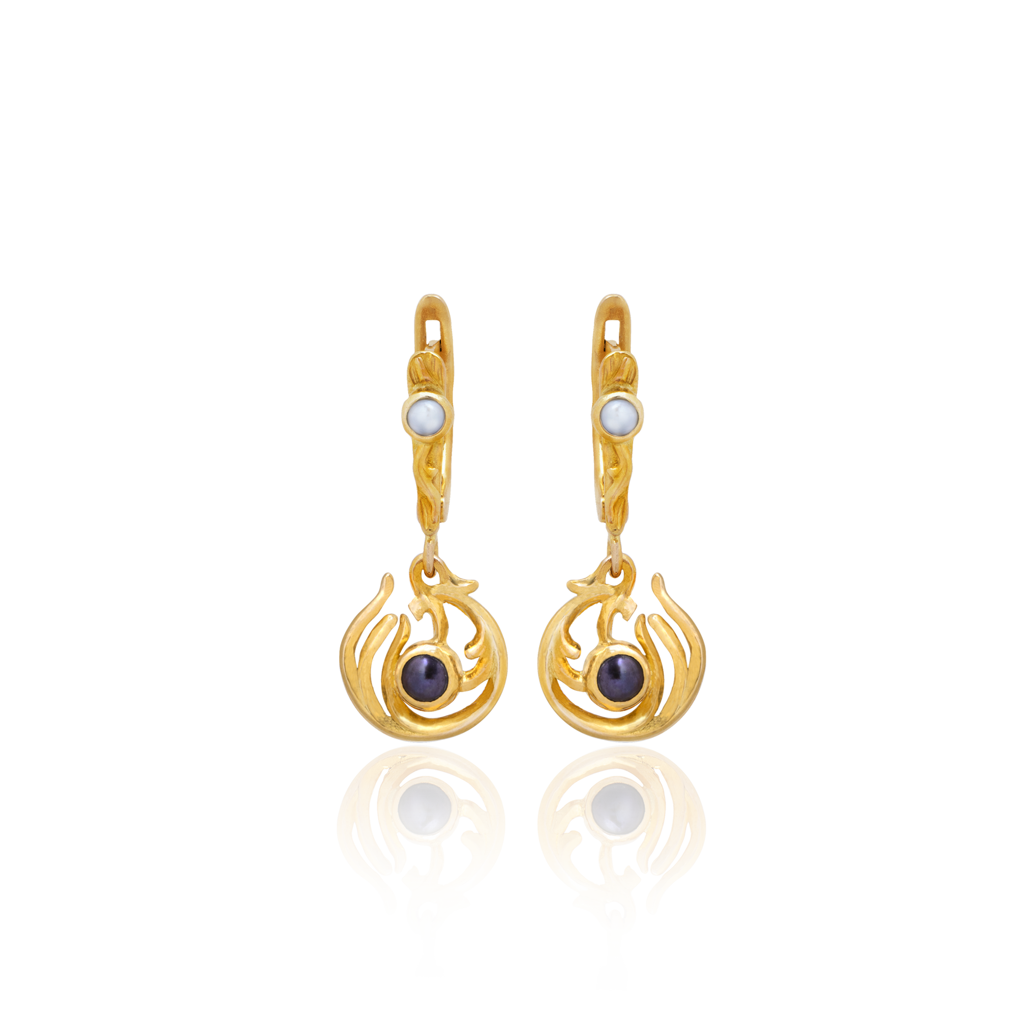 Pair of gold earrings with gemstones on a white background