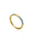 Gold ring with blue gemstones on a white background