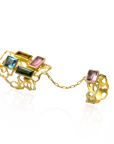 Gold bracelet with colorful gemstones on a white background