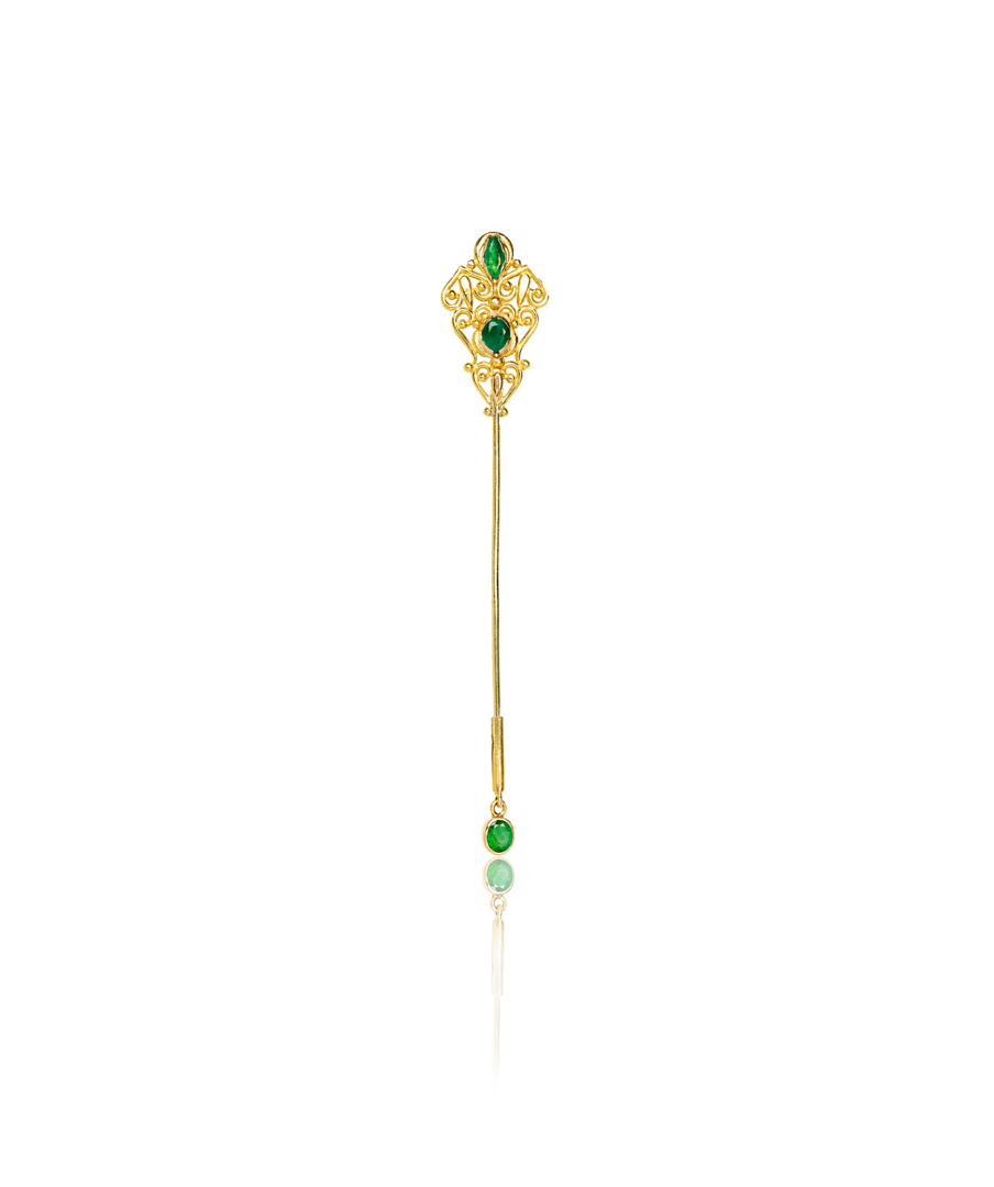 emerald brooch on white background