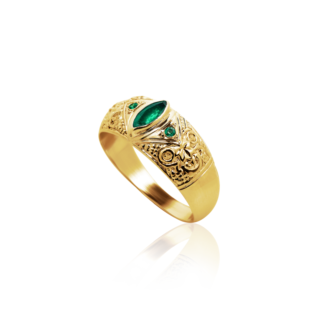 Gold ring with emerald stones on a white background
