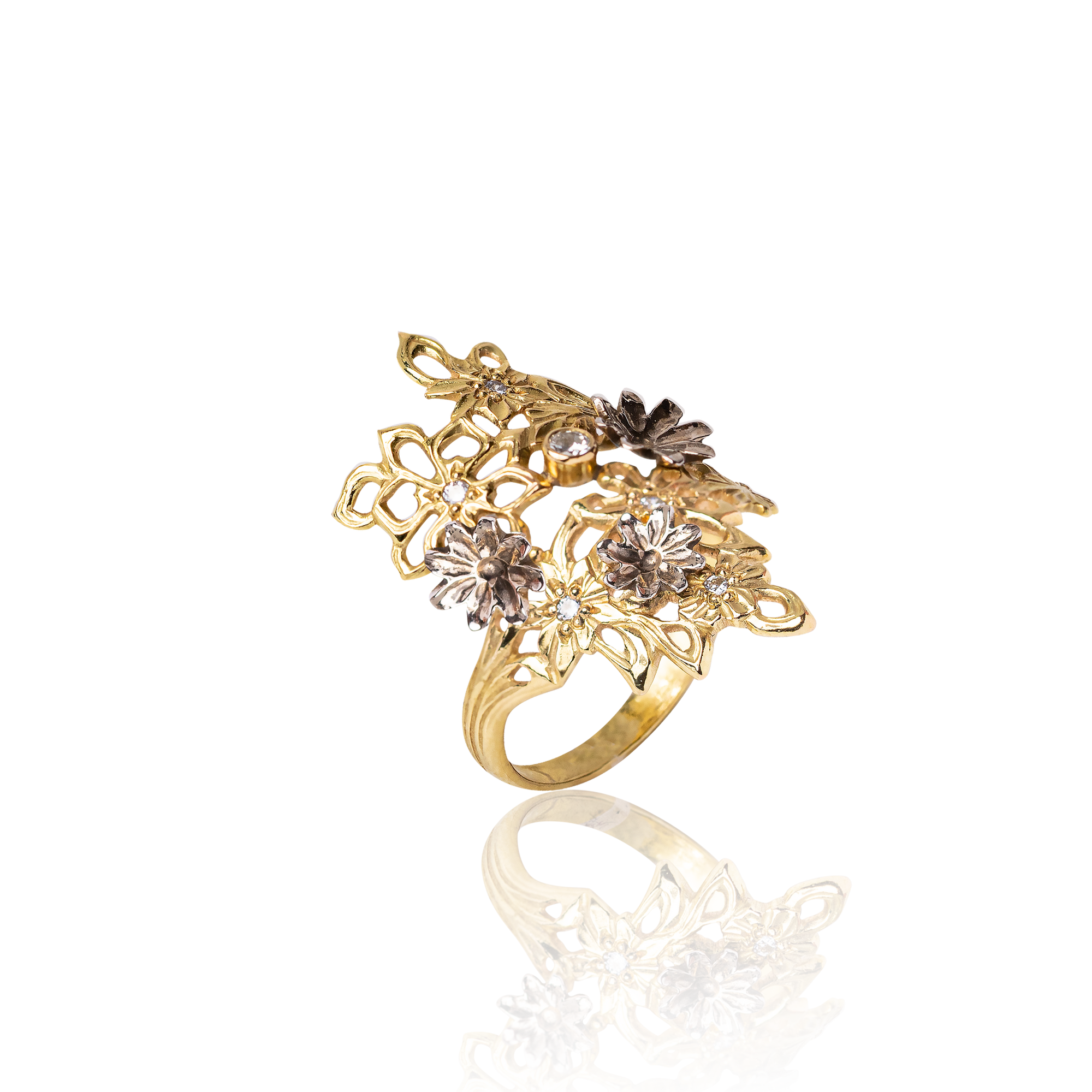 Gold ring with floral designs on a white background