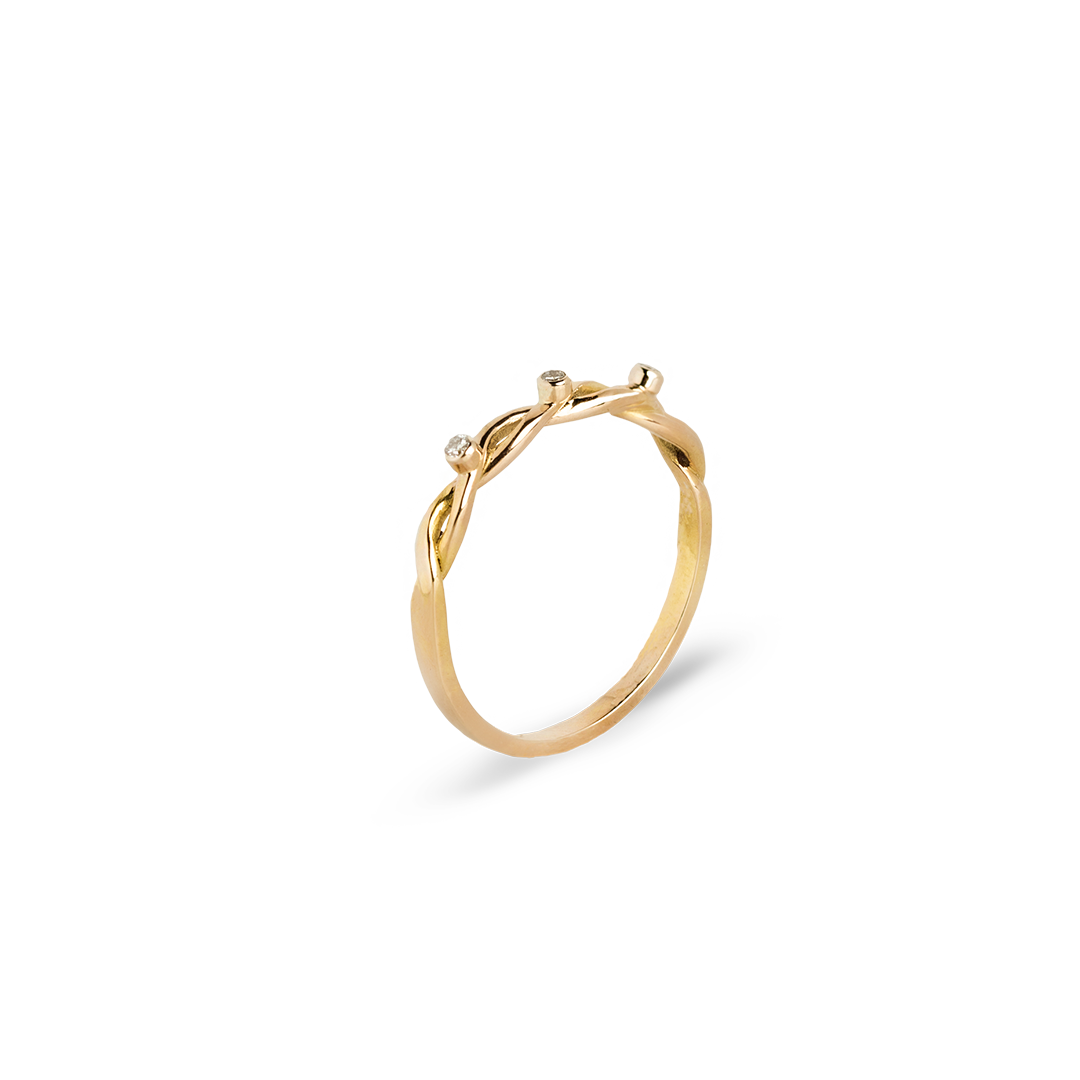 Gold ring with a subtle design on a white background 