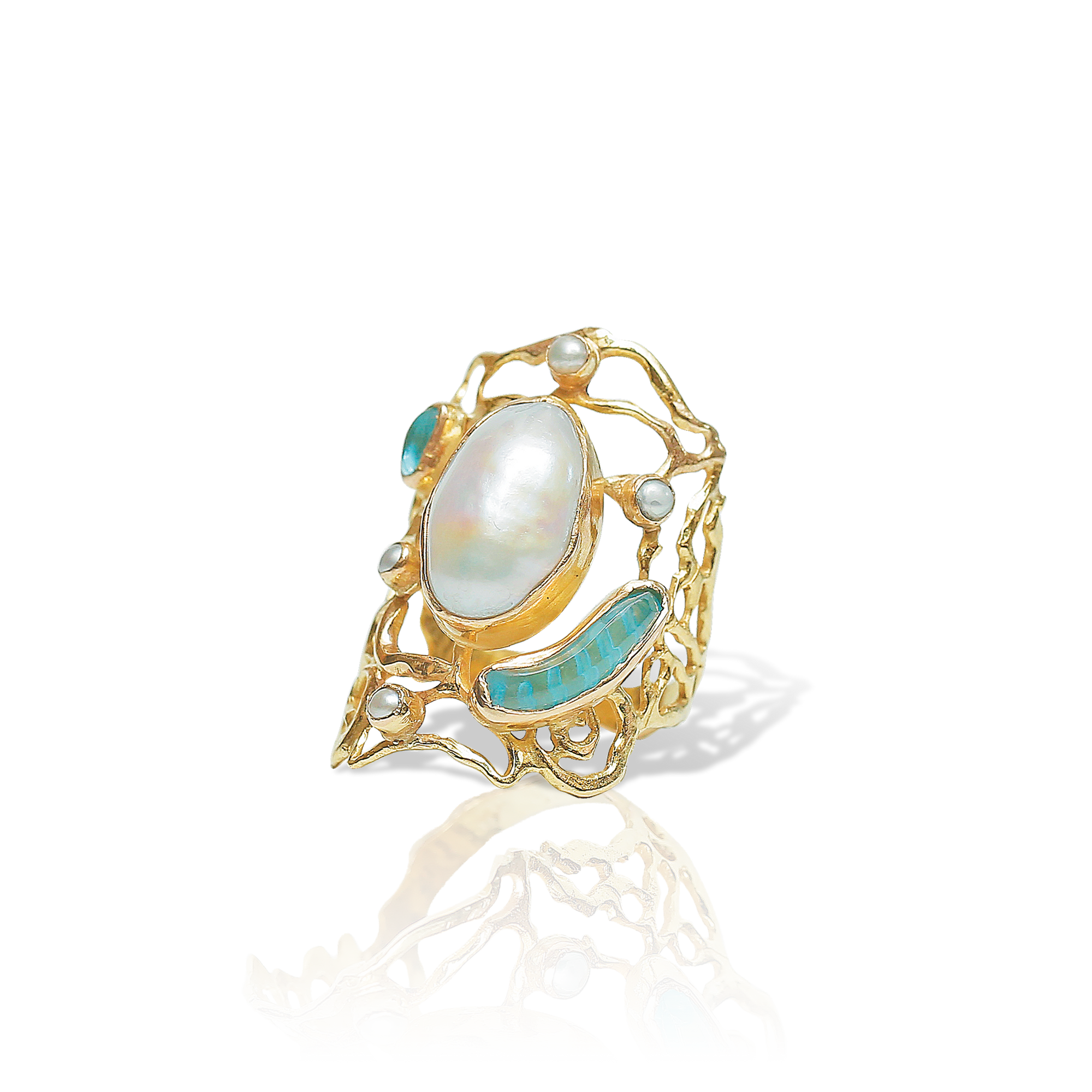Gold ring with a large central pearl and smaller stones on a white background