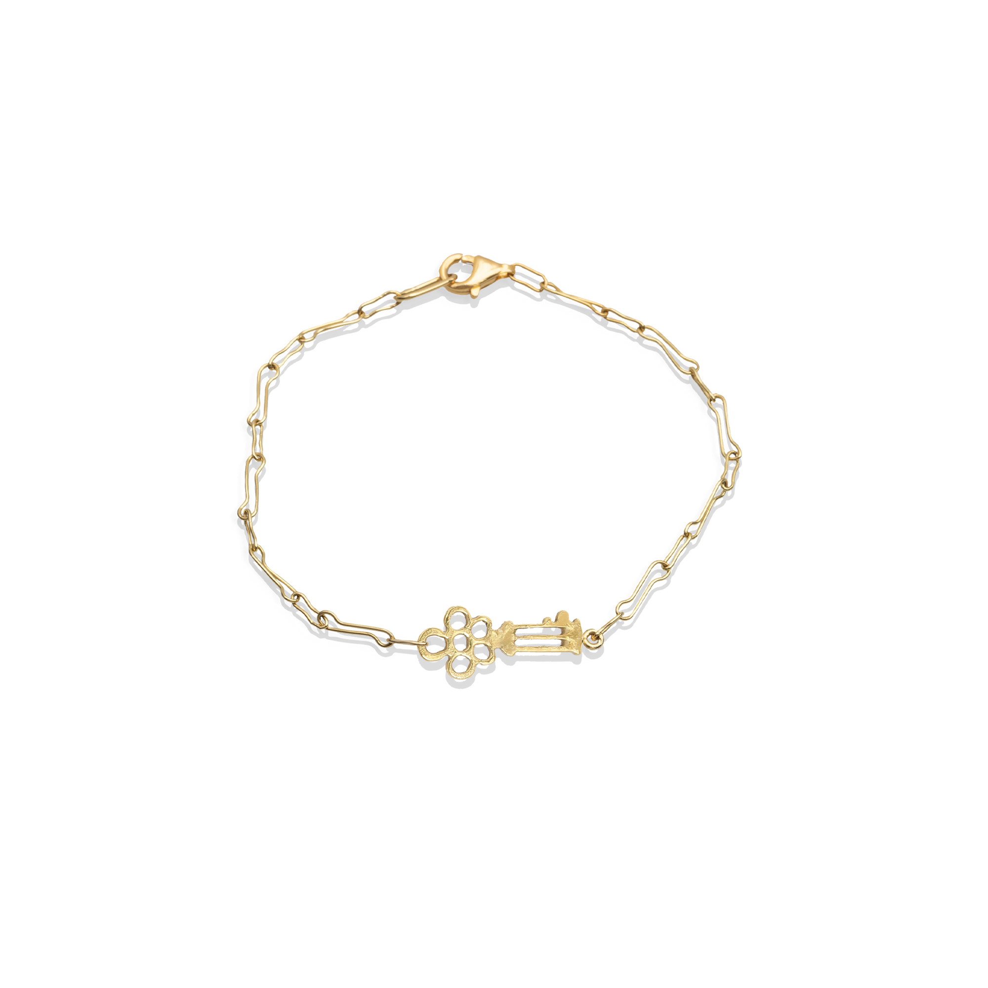 Gold bracelet with a unique clasp design on a white background