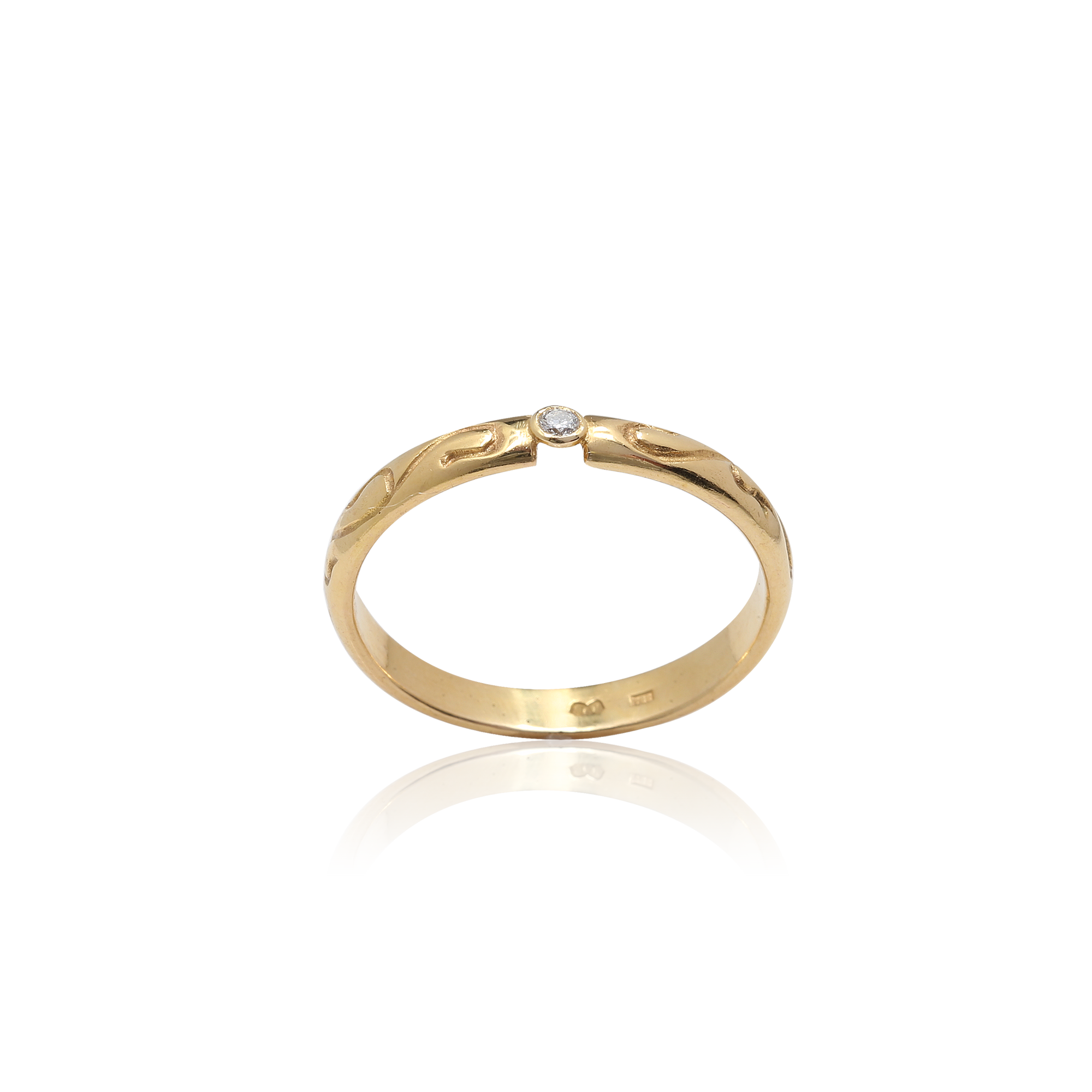 Gold ring with a diamond on a white background