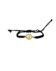 Black braided bracelet with a gold charm on a white background