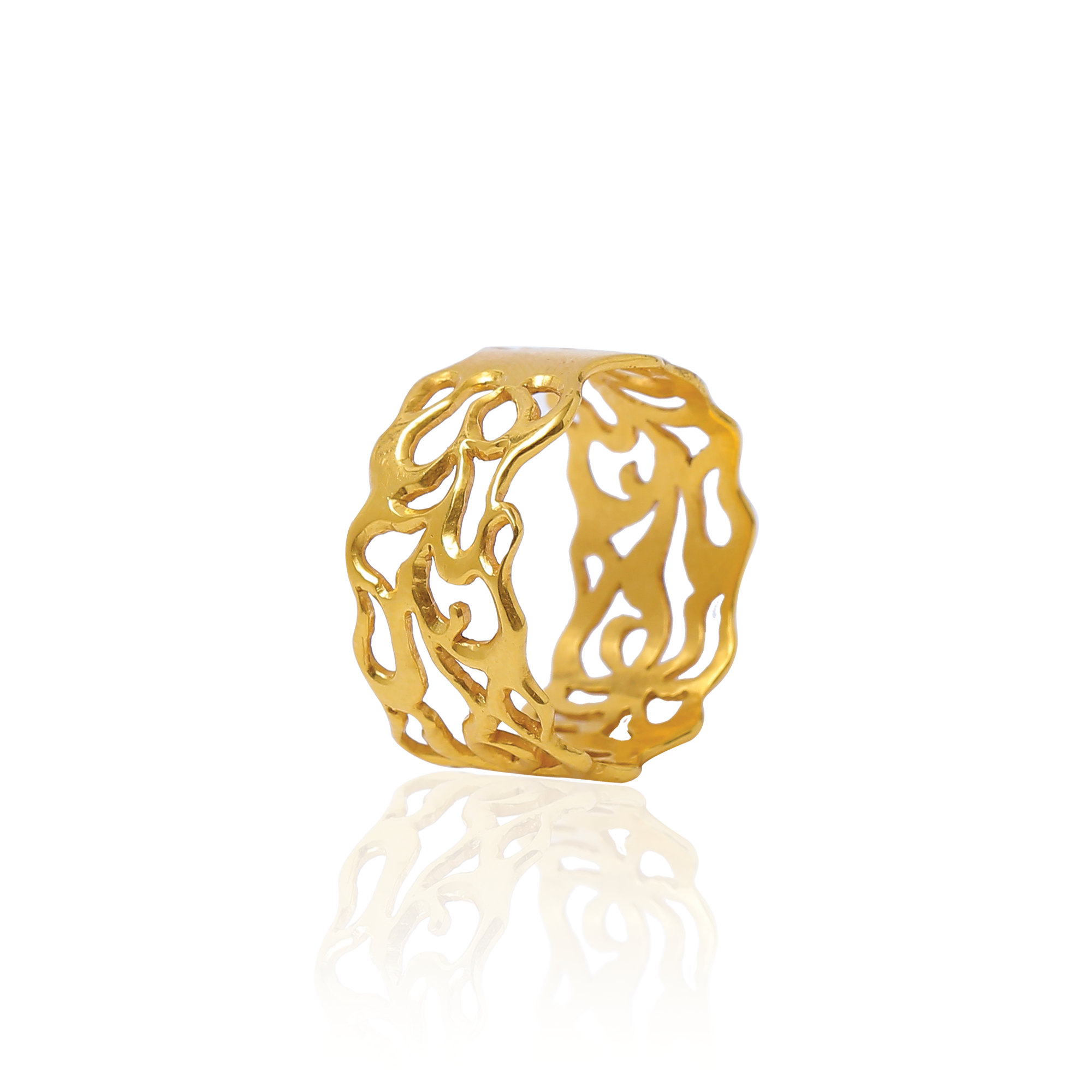 Gold ring with intricate design on a white background