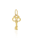 Gold key-shaped pendant on a white background