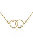 Gold necklace with interlocking rings and small diamonds on a white background