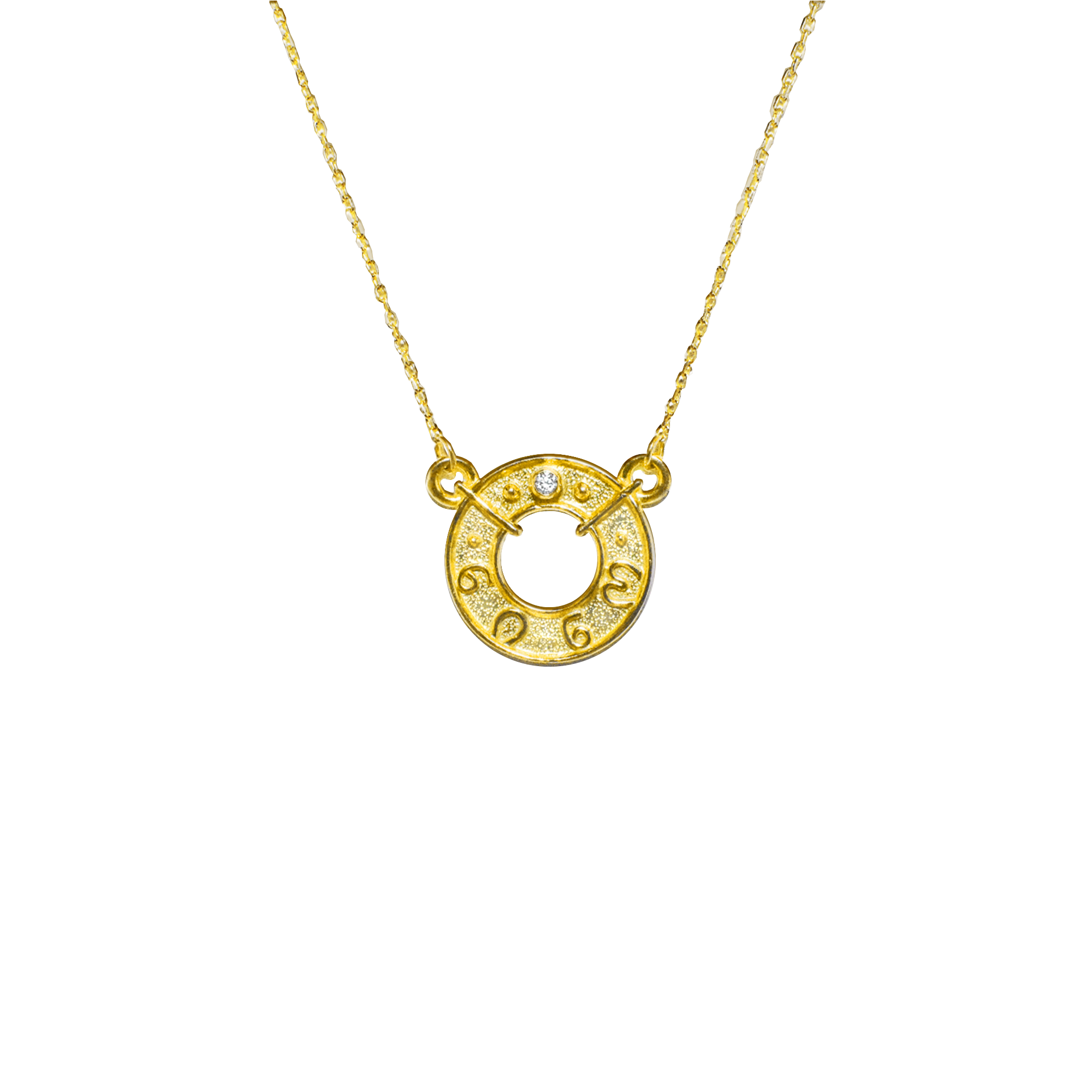Gold necklace with a circular pendant on a white background