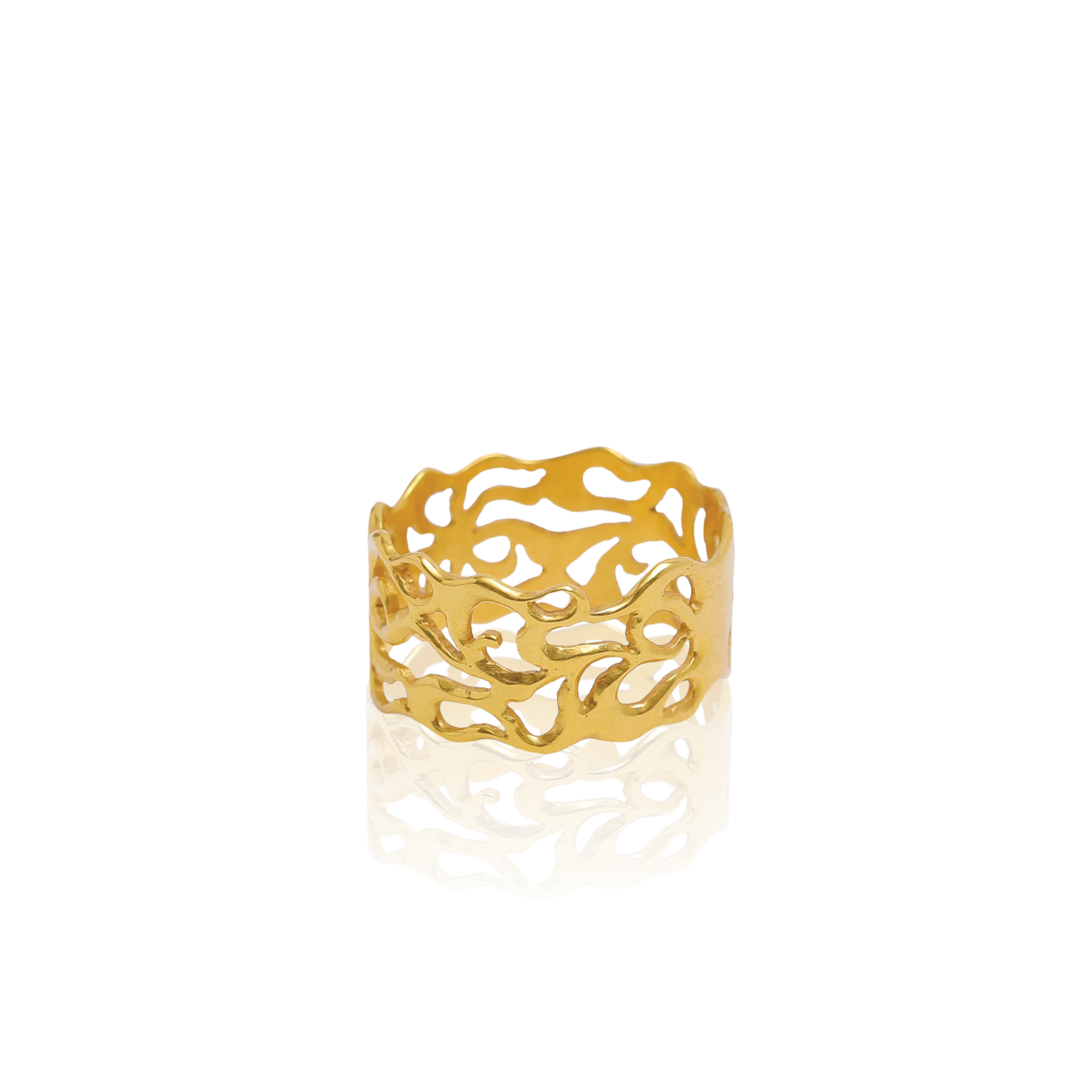 Gold ring with intricate design on a white background