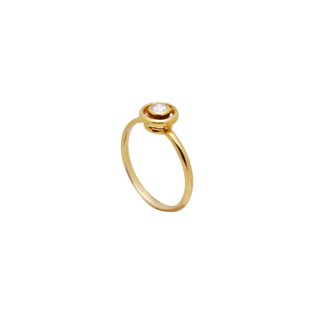 Gold ring with a small diamond on a white background