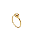 Gold ring with a small diamond on a white background