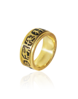 Gold ring with black engraved design on a white background