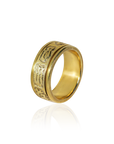 Gold ring with intricate designs on a white background