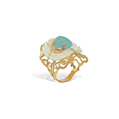 Gold ring with pearls and a green gemstone on a white background