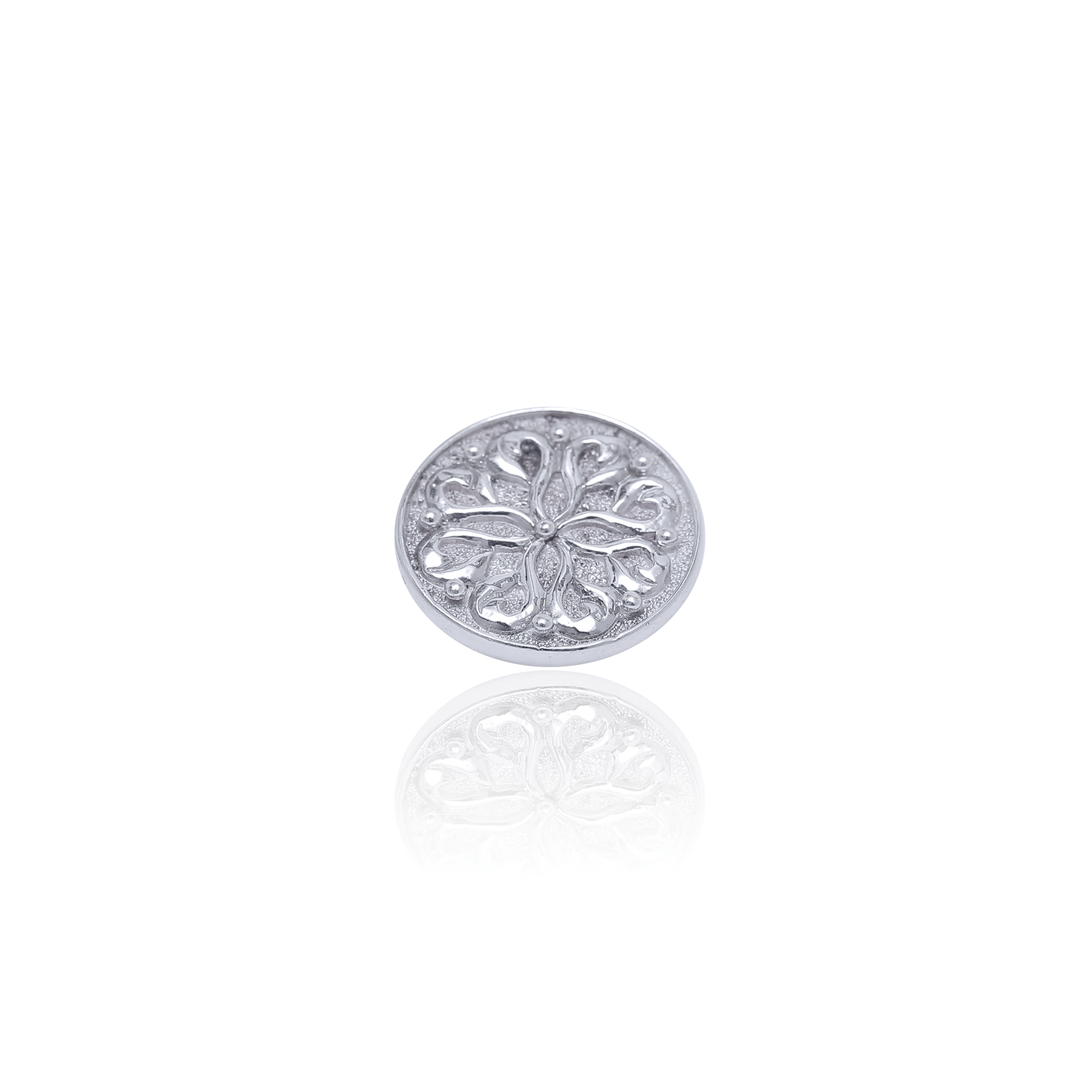 Silver floral design button on a white background