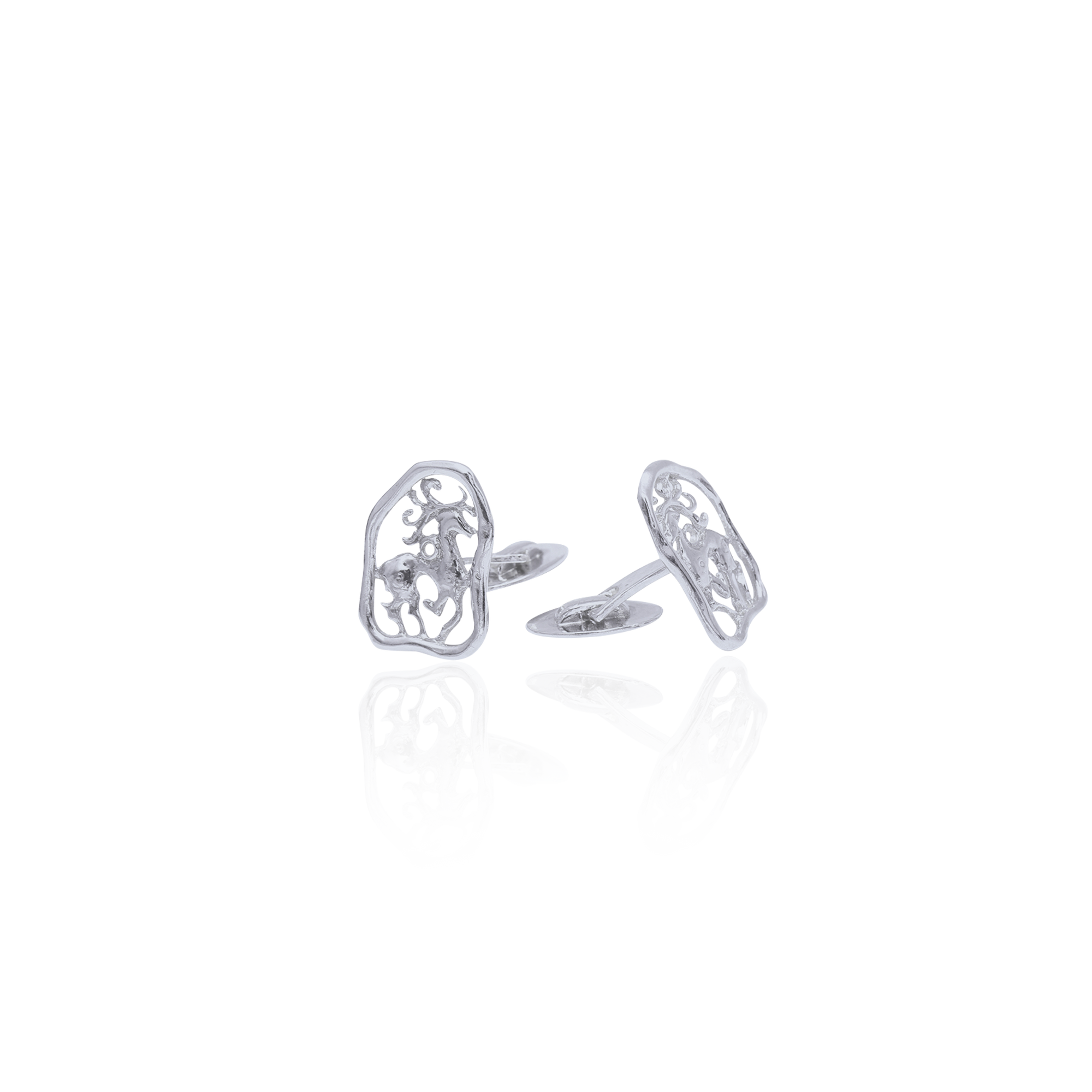 Sterling silver cufflinks featuring intricate openwork stag motifs in an ornamental sculptural design.