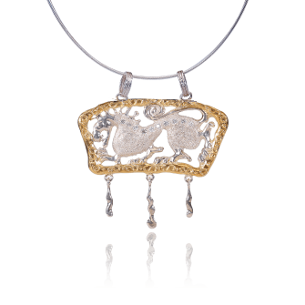Gold and silver necklace with a detailed pendant on a white background