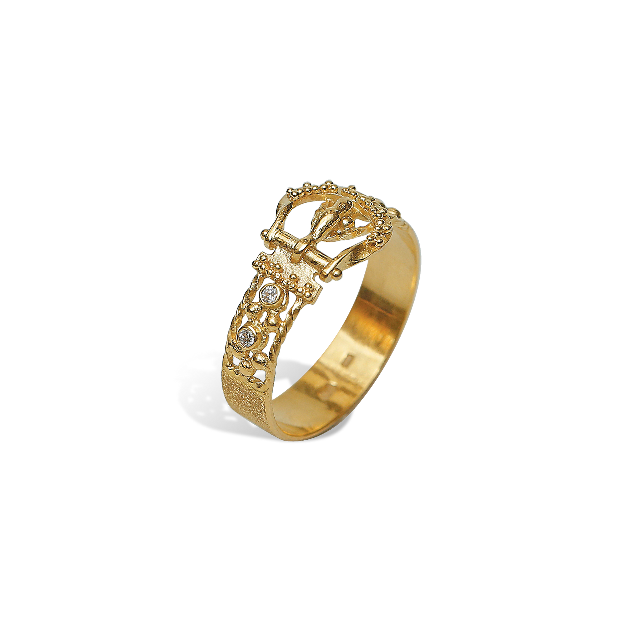 Gold ring with intricate design on a white background