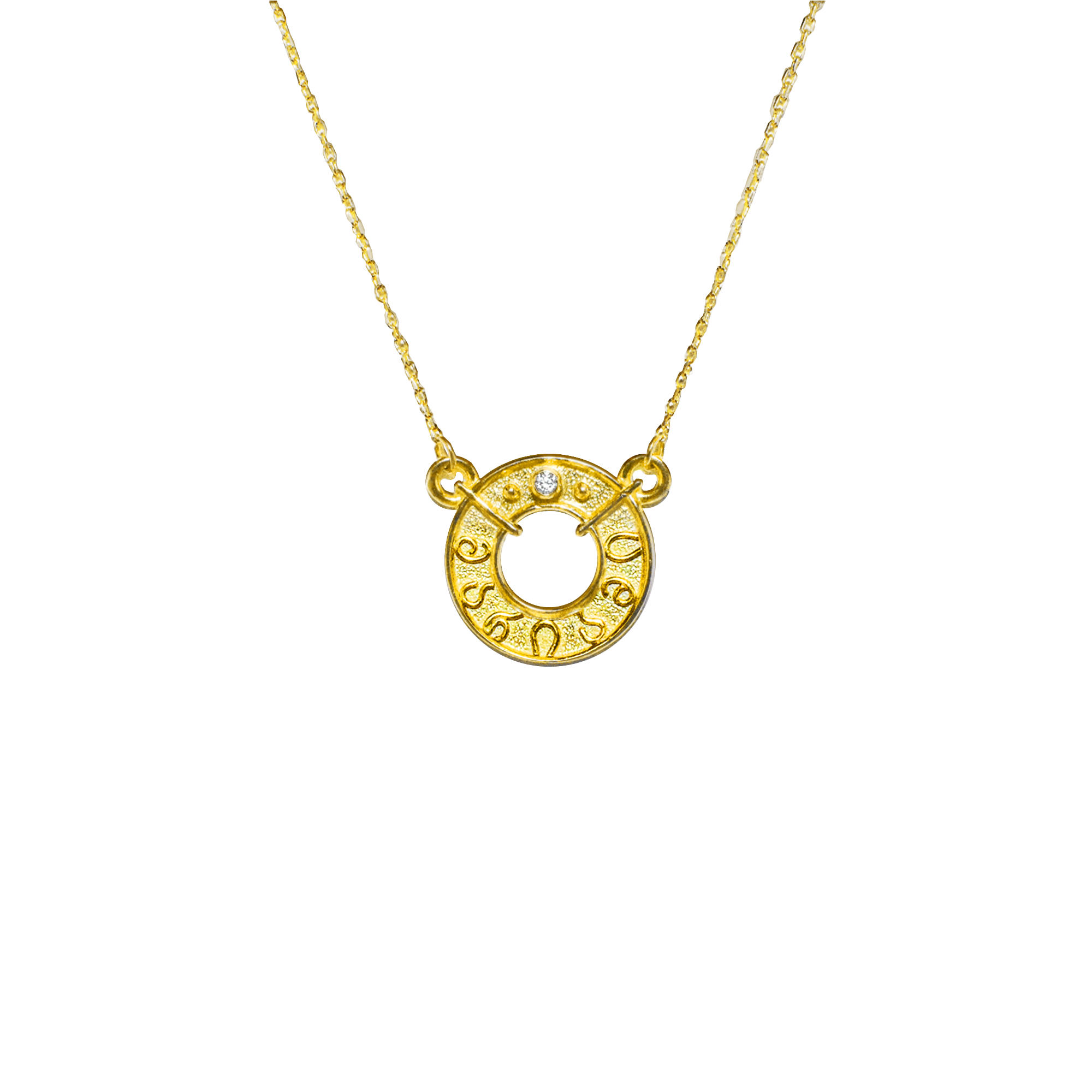 Gold necklace with a circular pendant on a white background