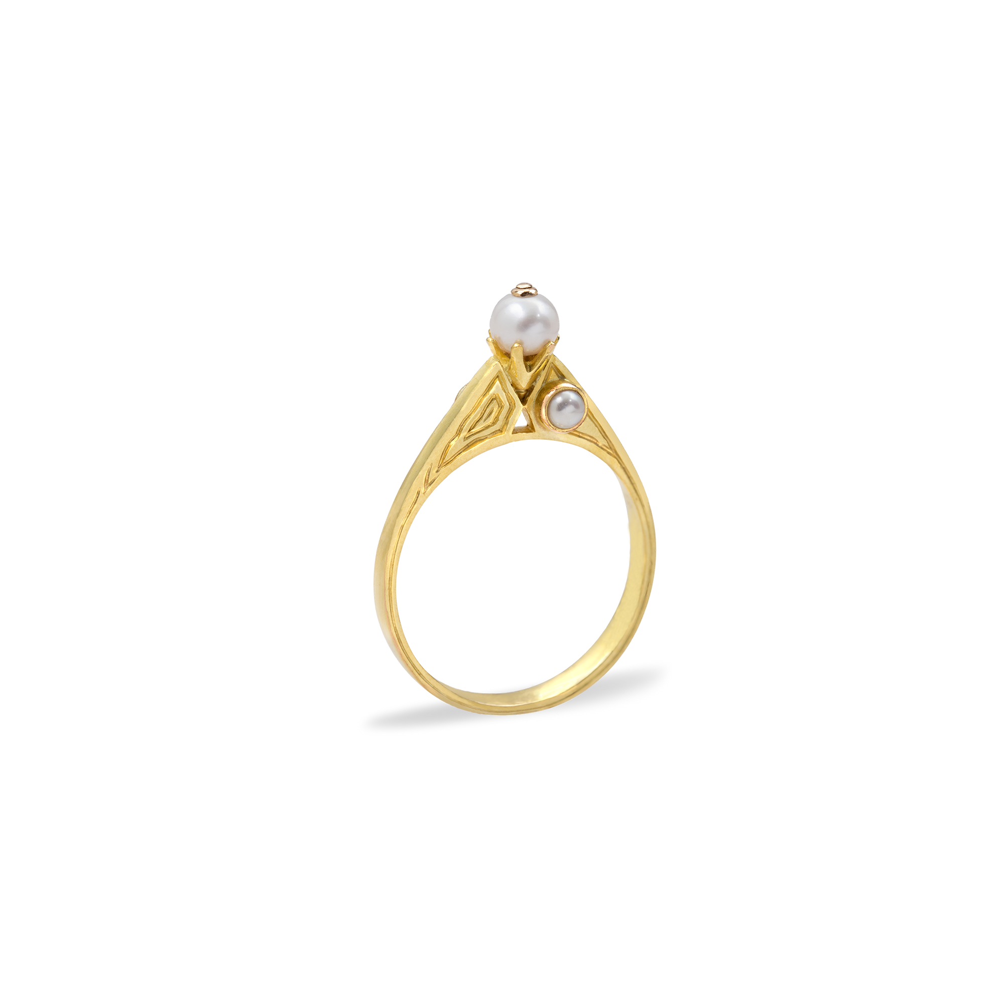 Gold ring with pearls on a white background