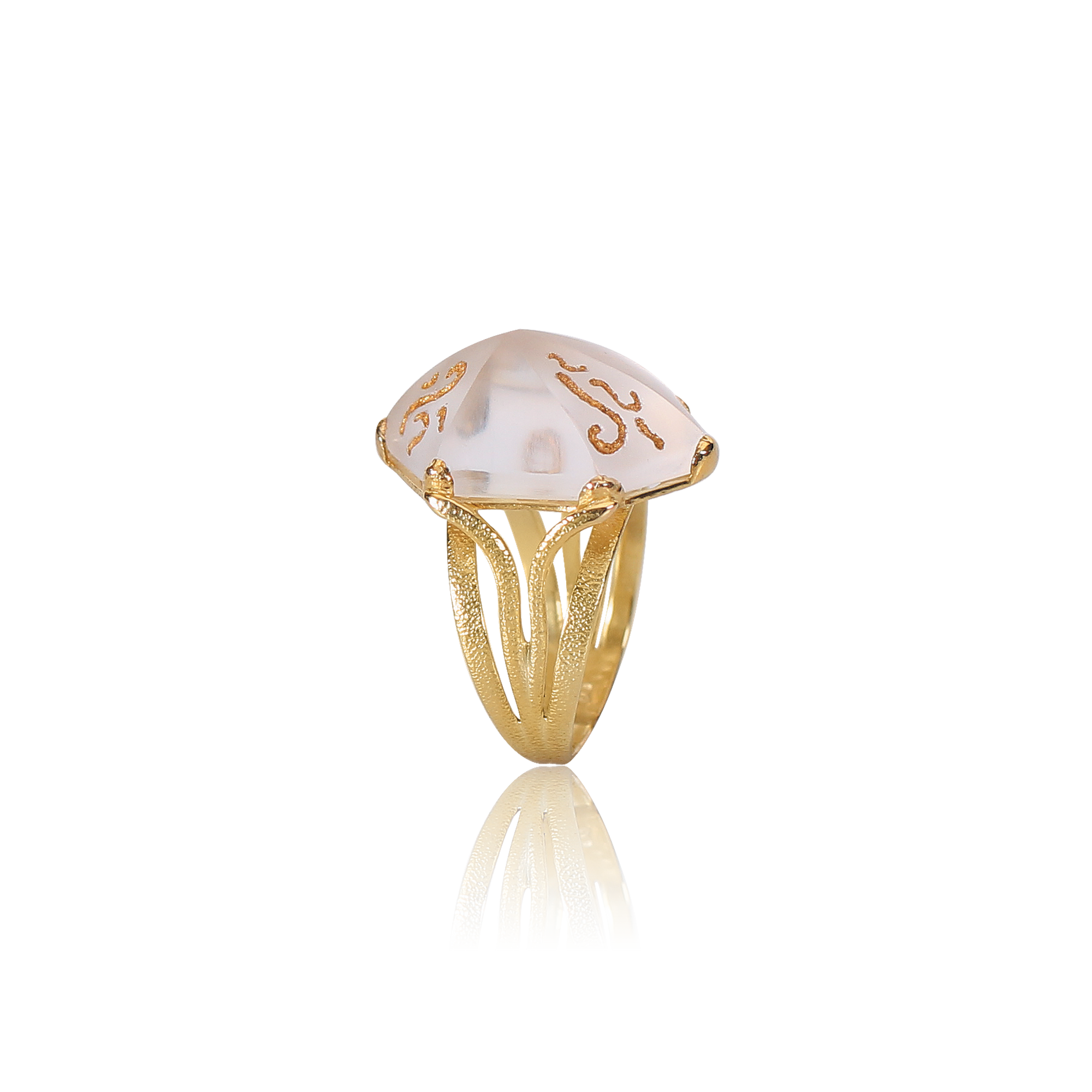 Gold ring with a white stone on a white background