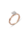 Rose gold ring with diamond cluster on a white background