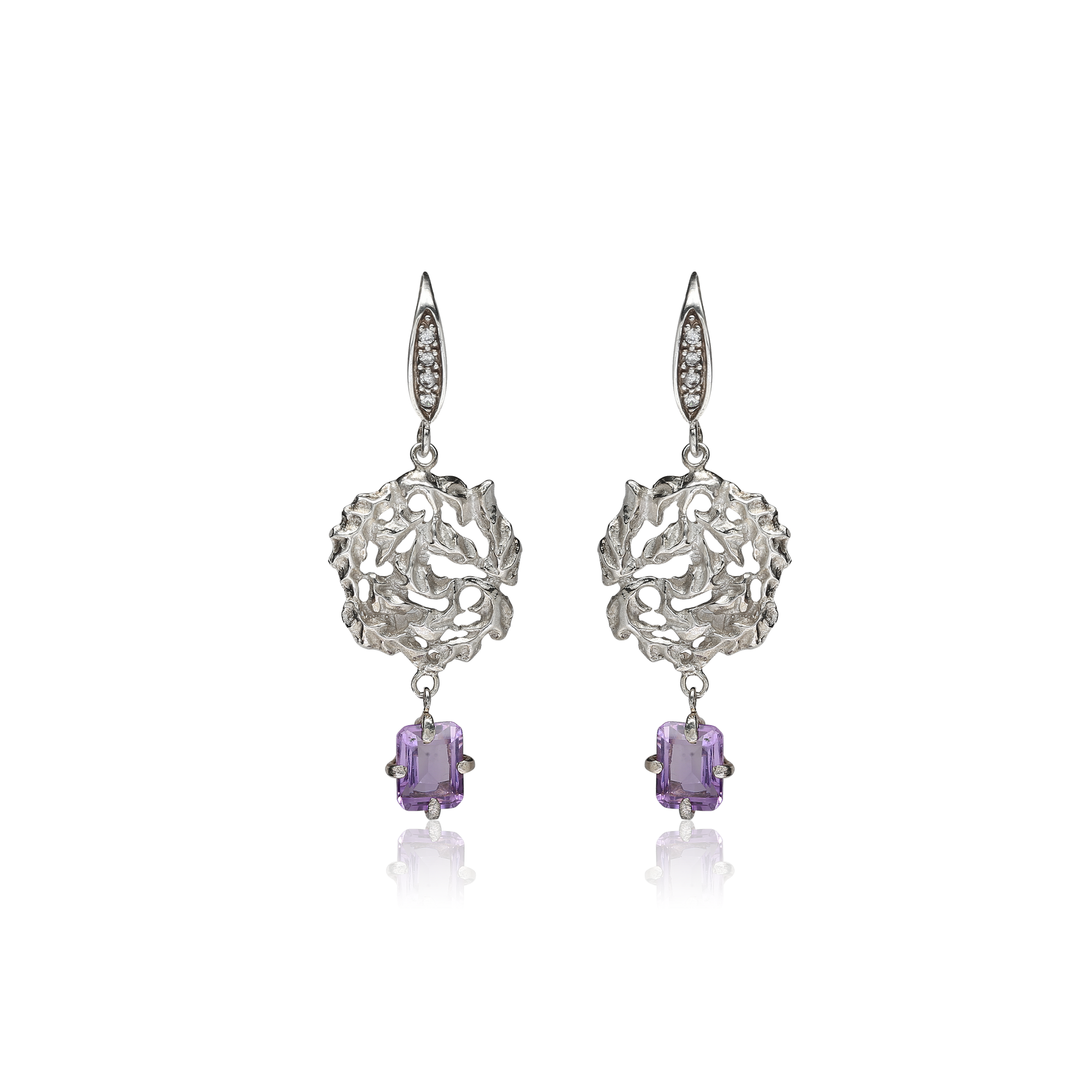 Silver earrings with purple gemstones on a white background