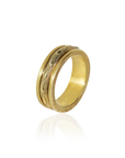 Gold ring with intricate design on a white background