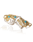 Gold and silver armour ring with turquoise stones on a white background