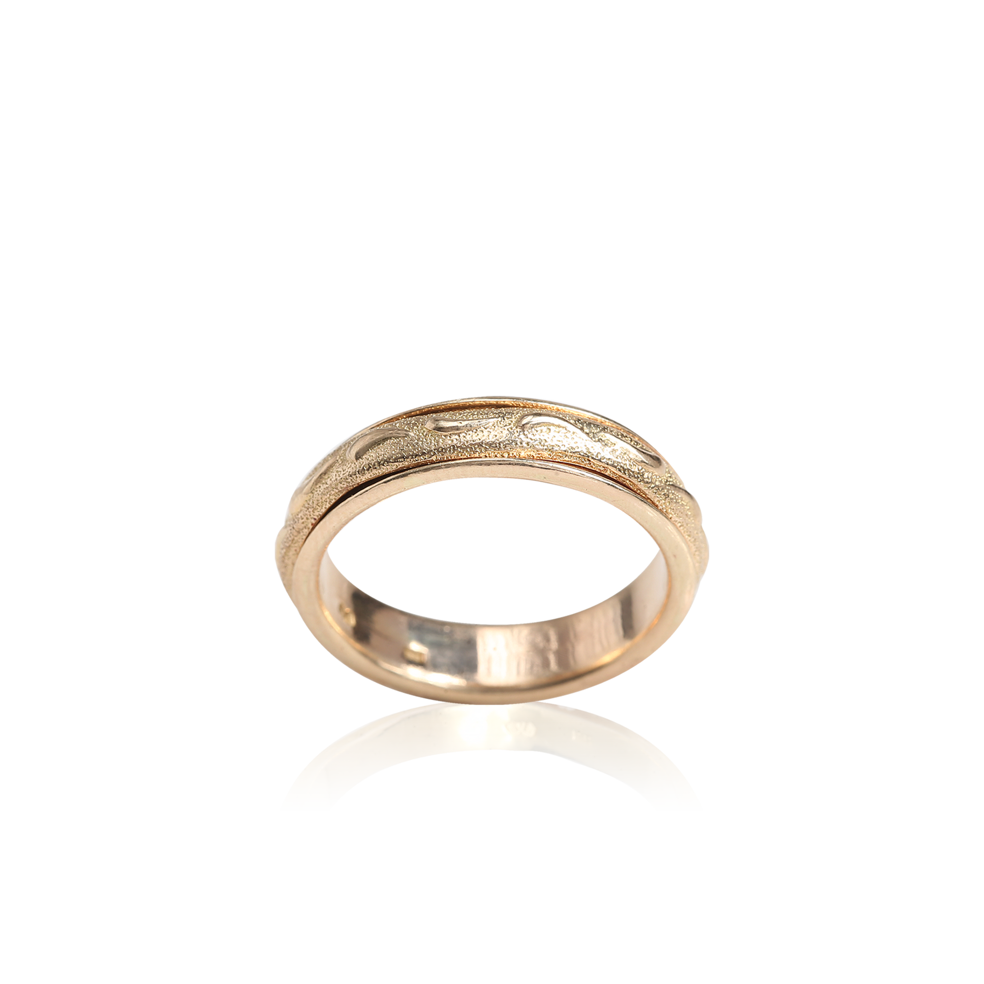 Gold ring with a textured band on a white background
