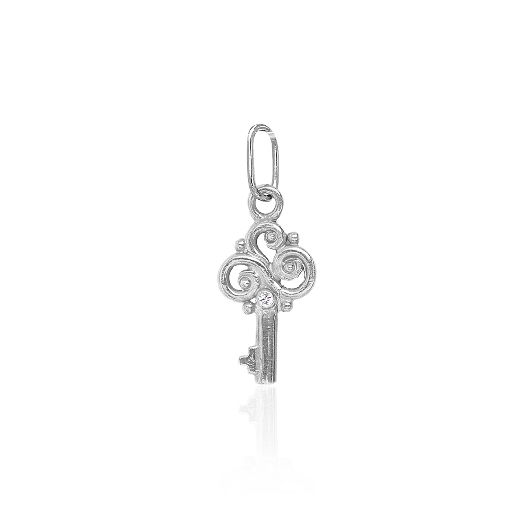 Silver key-shaped pendant on a white background