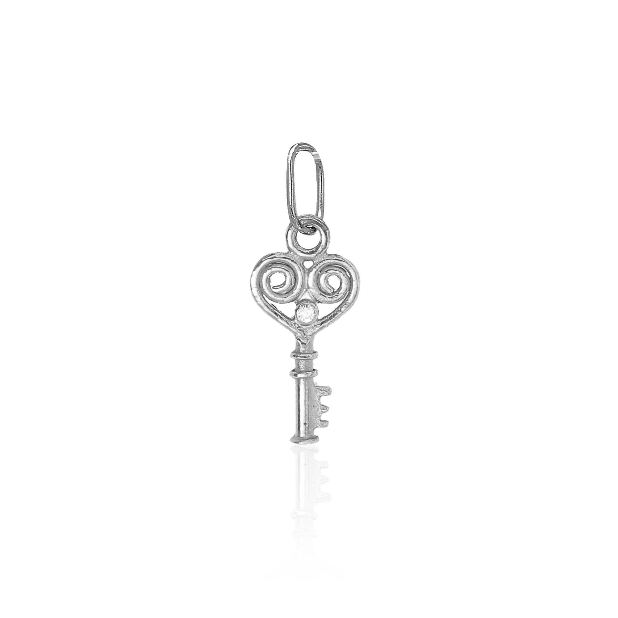 Silver key-shaped pendant on a white background