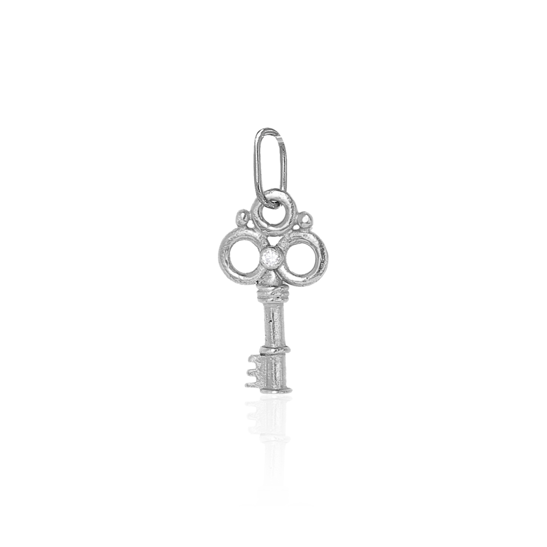 Silver key-shaped pendant on a white background