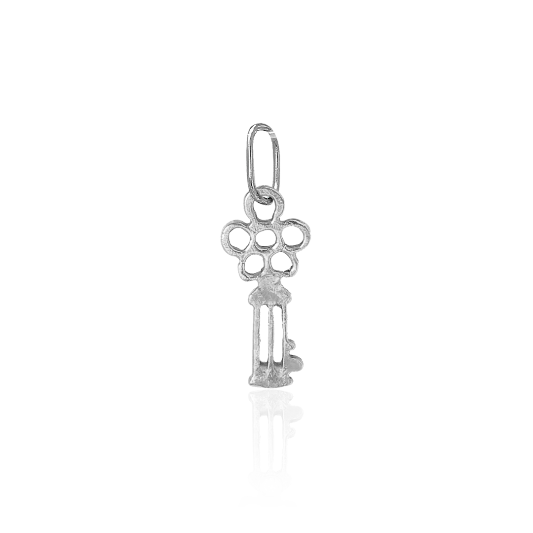 Silver key-shaped pendant on a white background