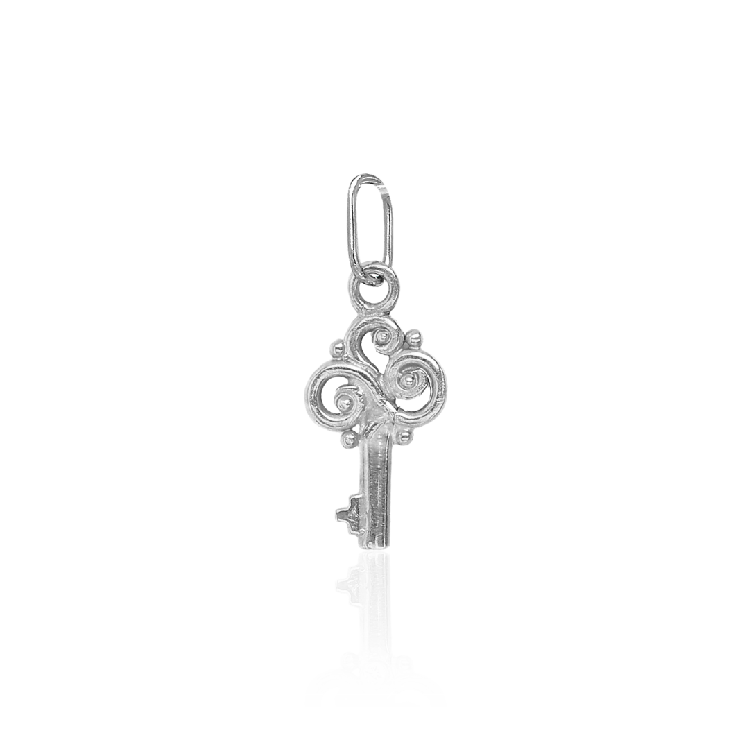 Silver key-shaped pendant on a white background