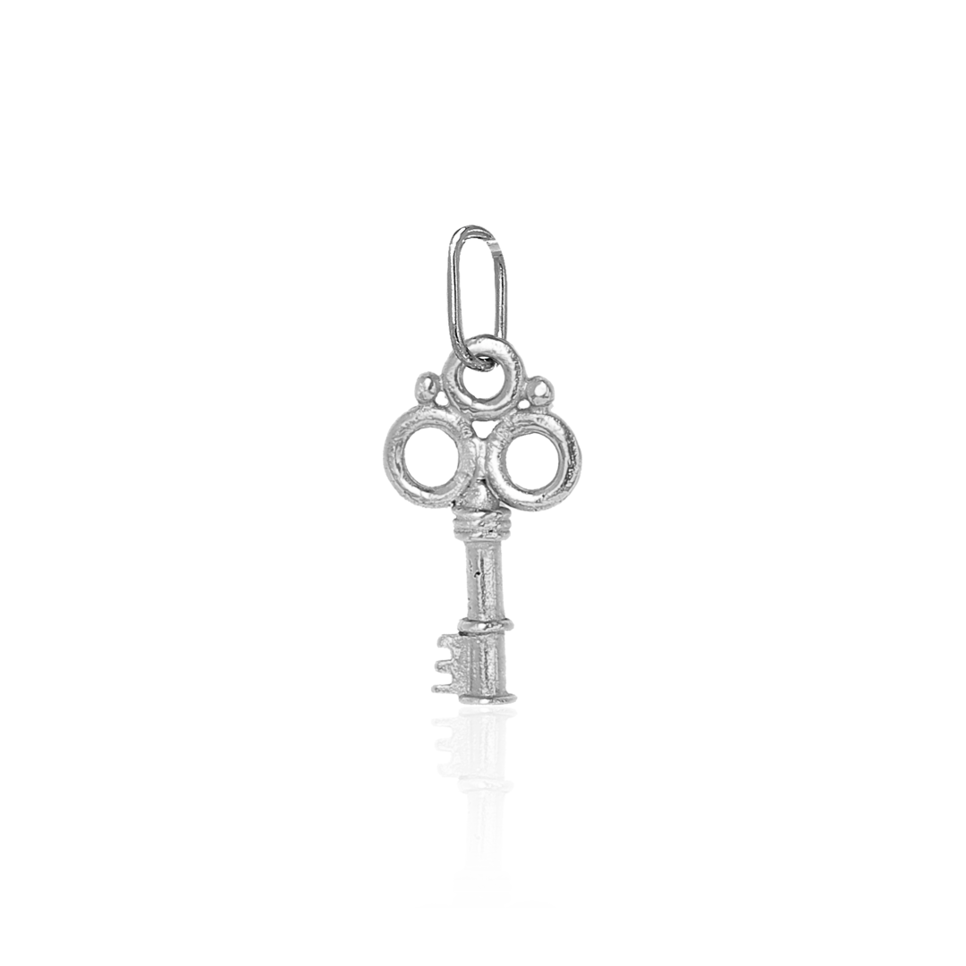 Silver key-shaped pendant on a white background